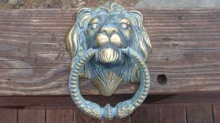 This vintage brass lion head door knocker weighs 3.36 lbs is 7 1/2 