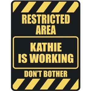   RESTRICTED AREA KATHIE IS WORKING  PARKING SIGN