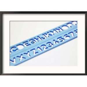  Blue Ruler Against White Background with Tracing of Alphabet 