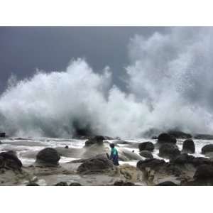  A Taiwanese Man is Dwarfed by Huge Waves Driven by Approaching 