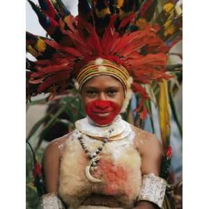  A Tribal Woman Decorated with Beads, Feathers, and Cowries 