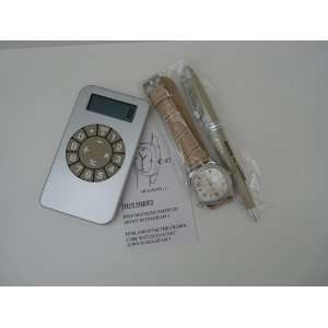   Style Calculator with a Tan Quartz Watch and Pen 