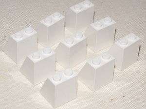   LOT OF 9 WHITE MINIFIG SKIRTS SLOPED PIECES THAT ARE USED FOR QEEENS