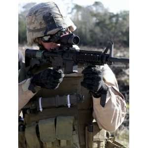  Soldier Looks Through the Scope of M 4 Carbine Rifle 
