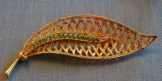 GOLD TONE BASKET WEAVE LEAF PIN WITH PERIDOT COLORED CRYSTALS  