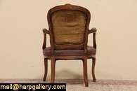 Hand carved of fruitwood about 1890, this traditional armchair has old 