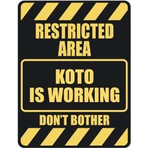   RESTRICTED AREA KOTO IS WORKING  PARKING SIGN