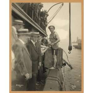 Harry Houdini,entering crate,New York Harbor,c1914