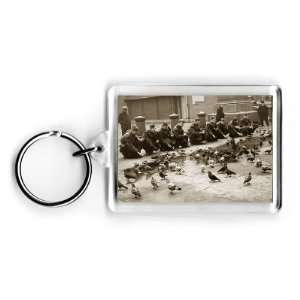  American troops feeding pigeons in London England 